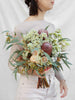 An Example of a Blush, Native inspired wedding bouquet. The pictured bouquet features Banksias, Flowering Gum, Blushing Brides, Wax Flower and eucalyptus tetragona. 